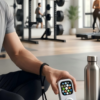 A person at the gym using a retro Apple Watch music device with earbuds and no phone distractions.