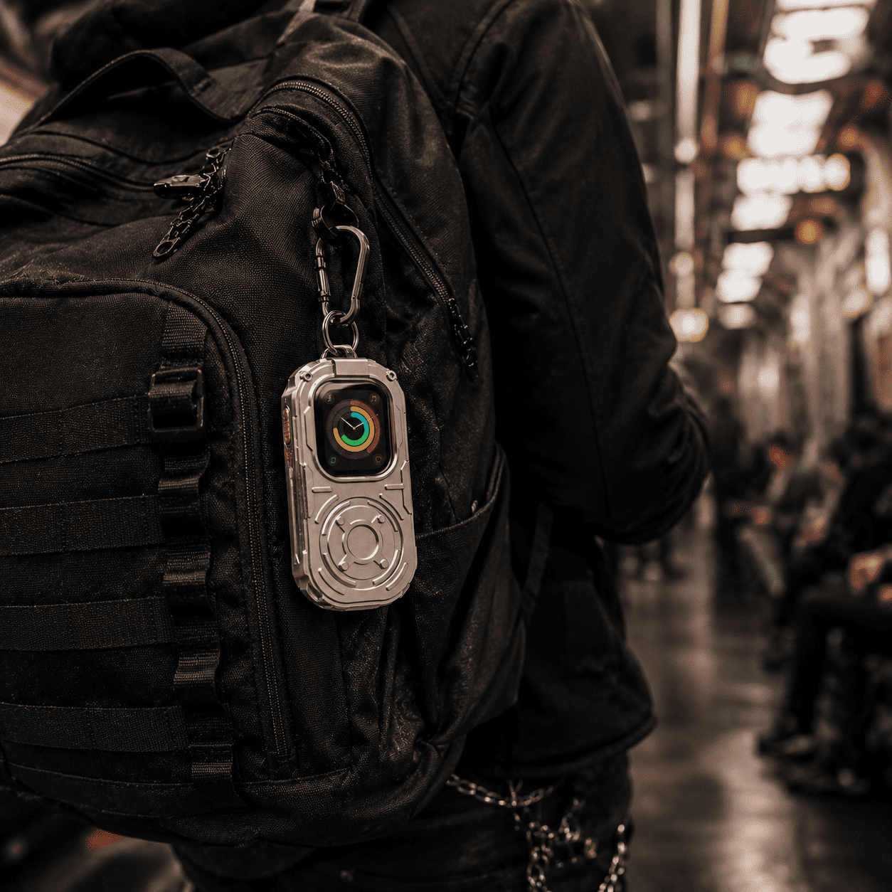 RePod Ultra Apple Watch Ultra case clipped to black backpack during urban commute