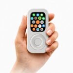 Silver RePod Apple Watch iPod case held in hand with app screen and circular scroll wheel