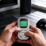 RePod Ultra Apple Watch Ultra case used as a handheld gaming device on a desktop setup